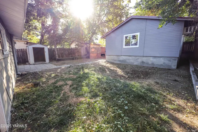 a backyard of a house with oven and couches