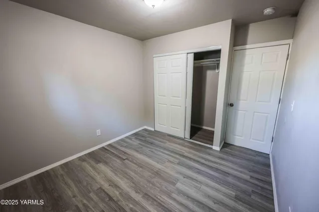 a view of a livingroom with wooden floor