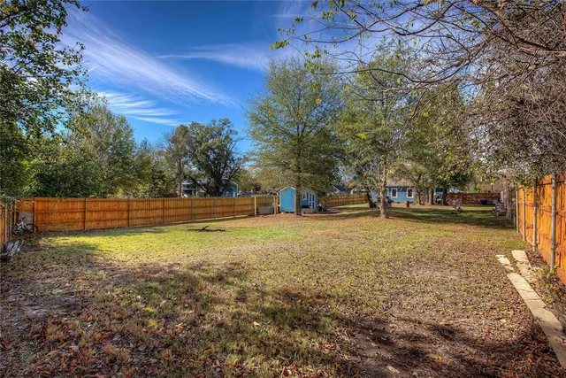 a living room with fireplace furniture and a flat screen tv