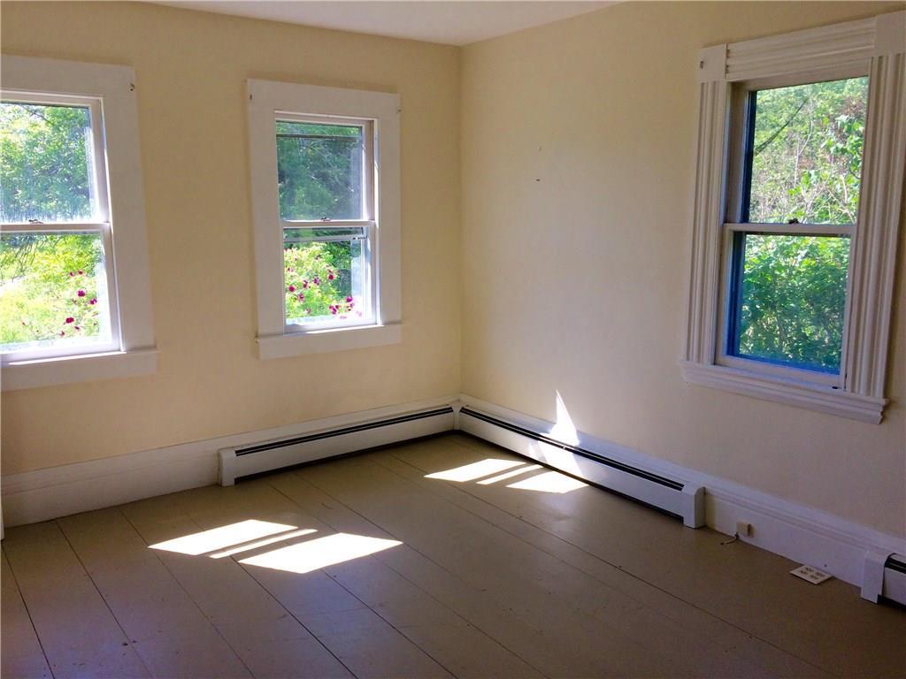 143 Tremont Road Bass Harbor, ME 04653 - Photo 10 of 29 First floor bedroom with partial...
