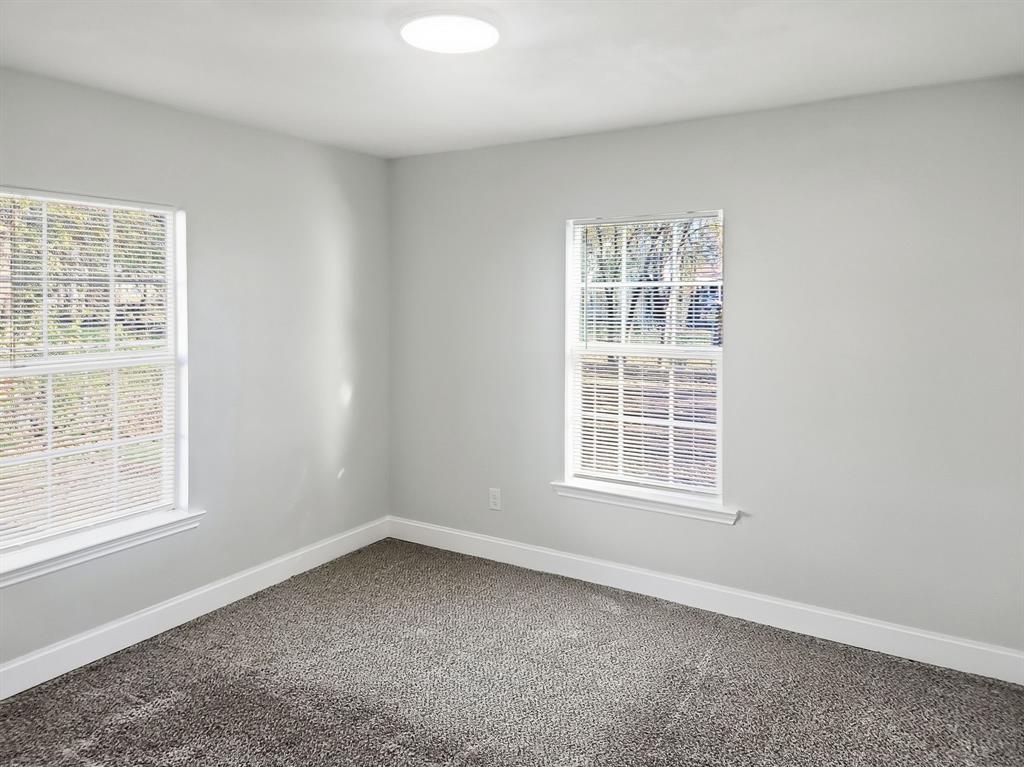 110 Ramsey Street Cleburne, TX 76031 - Photo 16 of 27 an empty room with a window