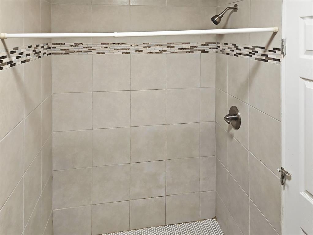 110 Ramsey Street Cleburne, TX 76031 - Photo 19 of 27 a bathroom with a shower