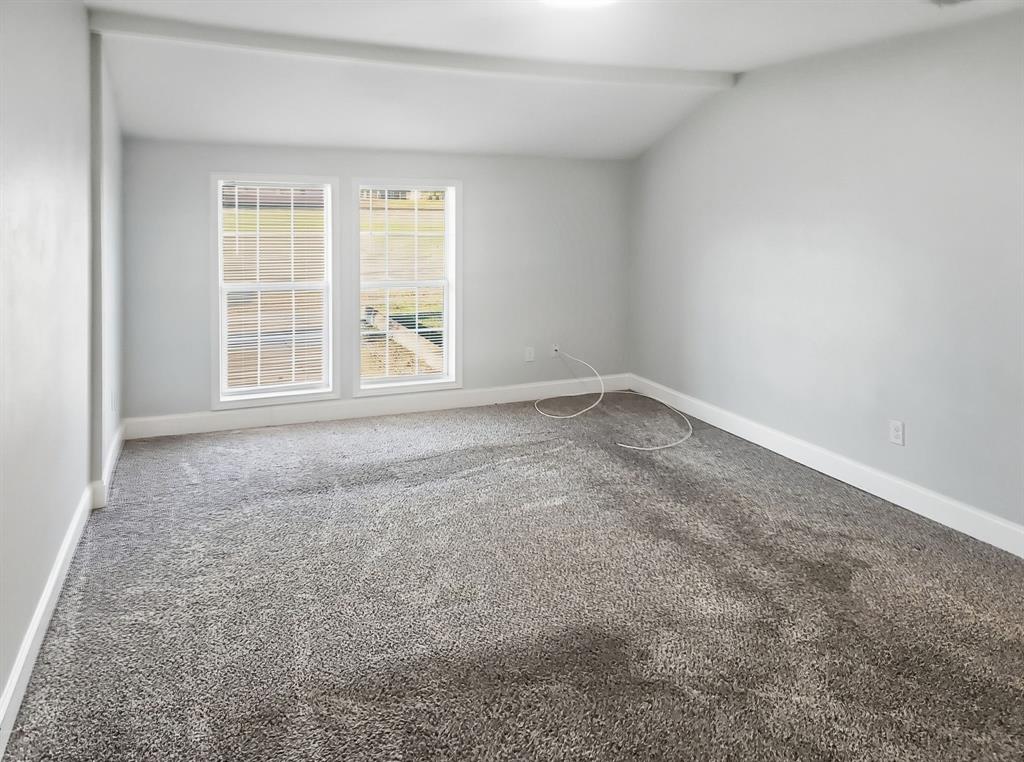 110 Ramsey Street Cleburne, TX 76031 - Photo 10 of 27 an empty room with a window