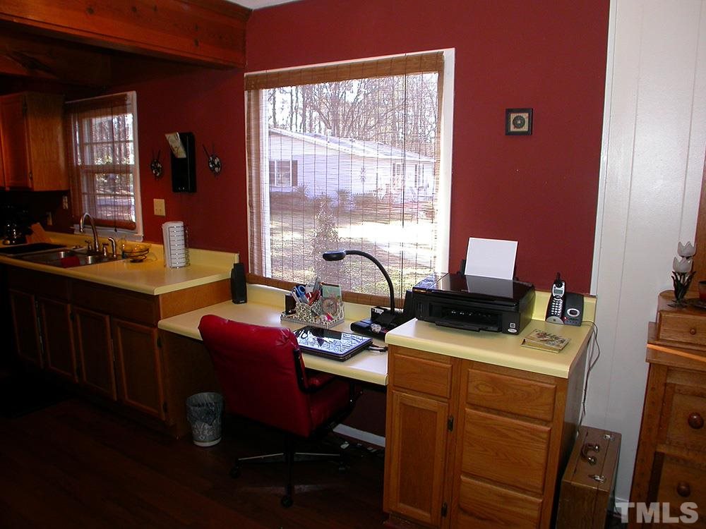 6301 Johnsdale Road Raleigh, NC 27615 - Photo 13 of 25 a view of a workspace with furniture and window
