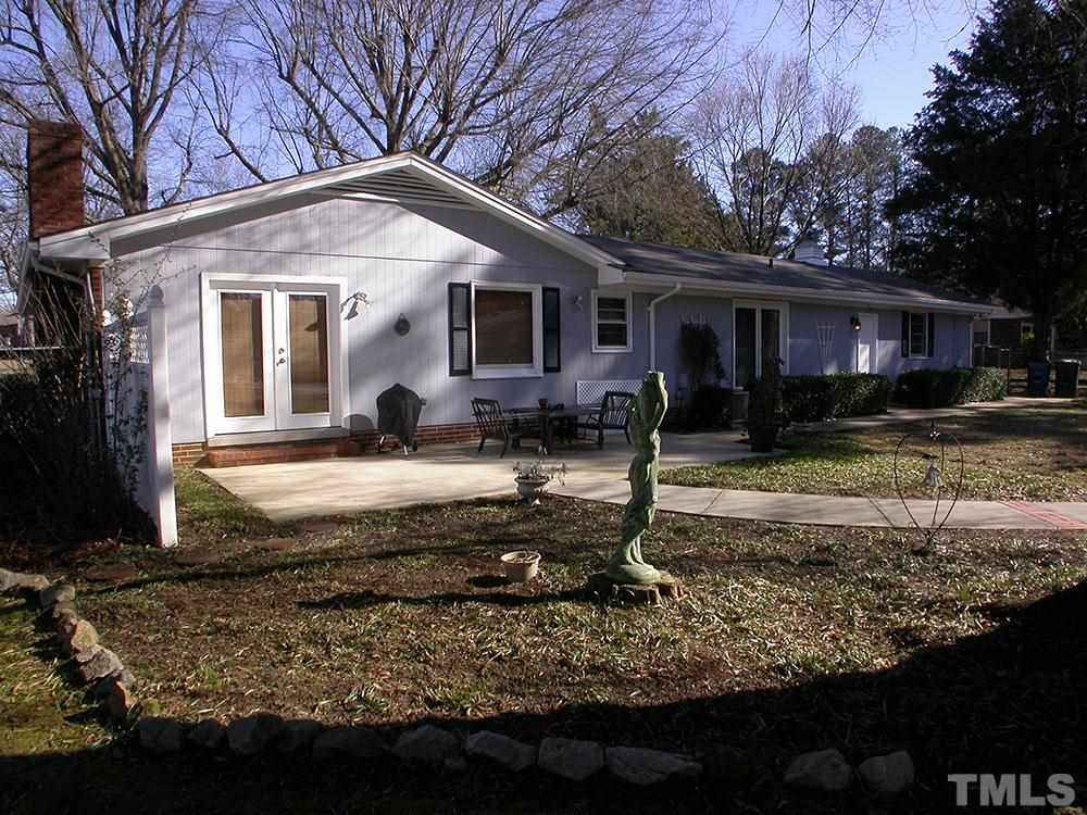 6301 Johnsdale Road Raleigh, NC 27615 - Photo 20 of 25 a front view of a house with garden