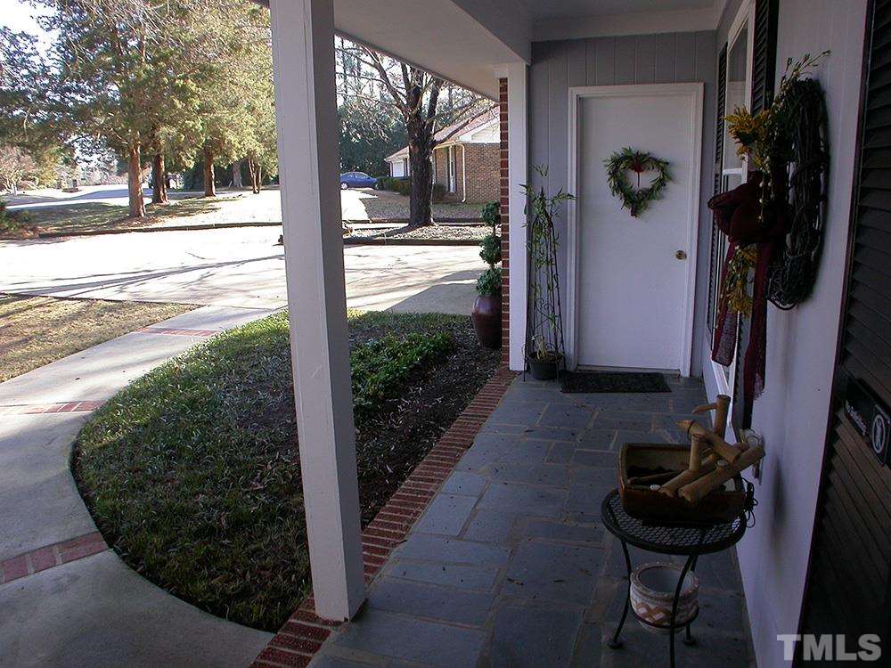 6301 Johnsdale Road Raleigh, NC 27615 - Photo 3 of 25 a view of a porch with garden