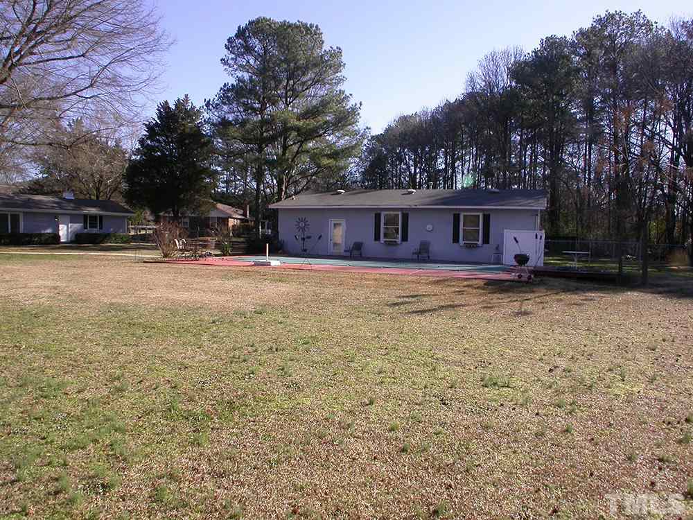 6301 Johnsdale Road Raleigh, NC 27615 - Photo 24 of 25 front view of a house with a yard