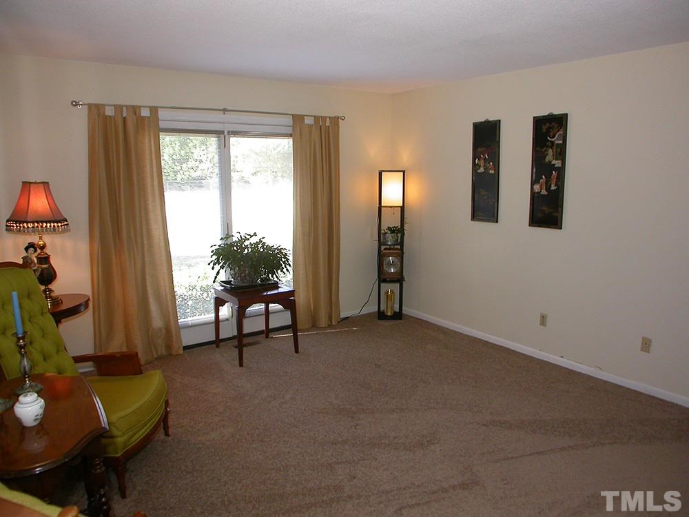 6301 Johnsdale Road Raleigh, NC 27615 - Photo 4 of 25 a living room with furniture and a window