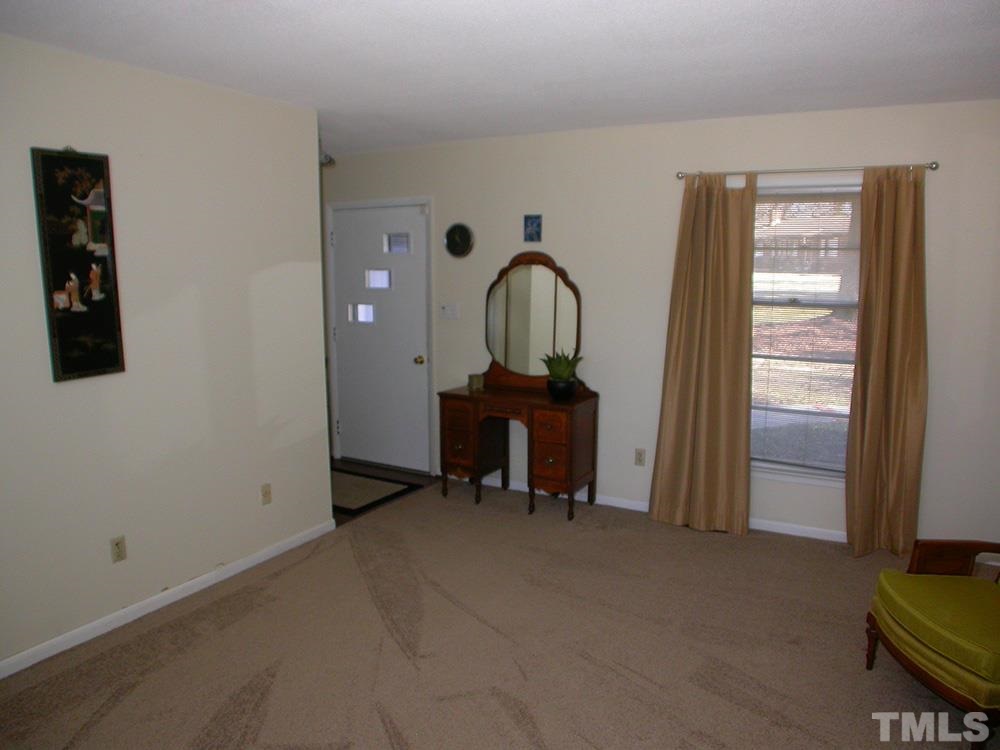6301 Johnsdale Road Raleigh, NC 27615 - Photo 5 of 25 a view of a livingroom with furniture and a window