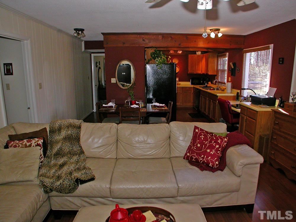 6301 Johnsdale Road Raleigh, NC 27615 - Photo 6 of 25 a living room with furniture and a fireplace