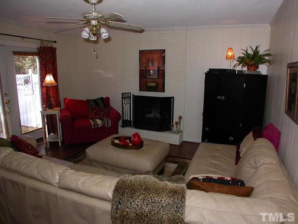 6301 Johnsdale Road Raleigh, NC 27615 - Photo 7 of 25 a living room with furniture flowerpot and window