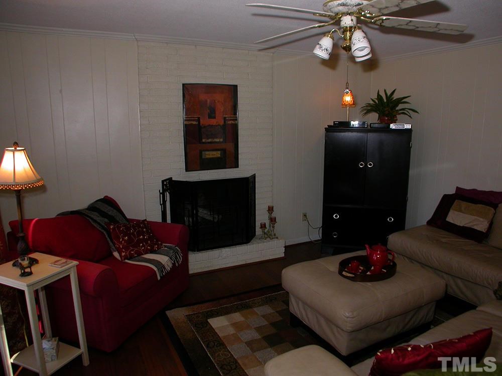 6301 Johnsdale Road Raleigh, NC 27615 - Photo 8 of 25 a living room with furniture and a fireplace