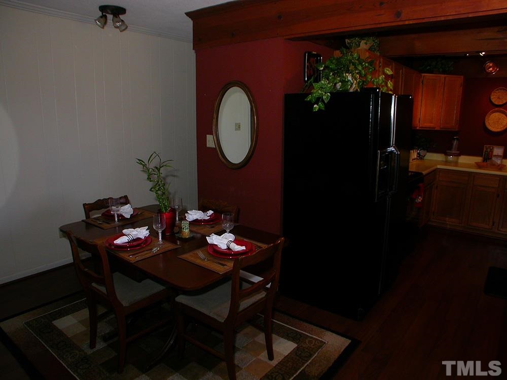 6301 Johnsdale Road Raleigh, NC 27615 - Photo 9 of 25 a dining room with furniture and wooden floor