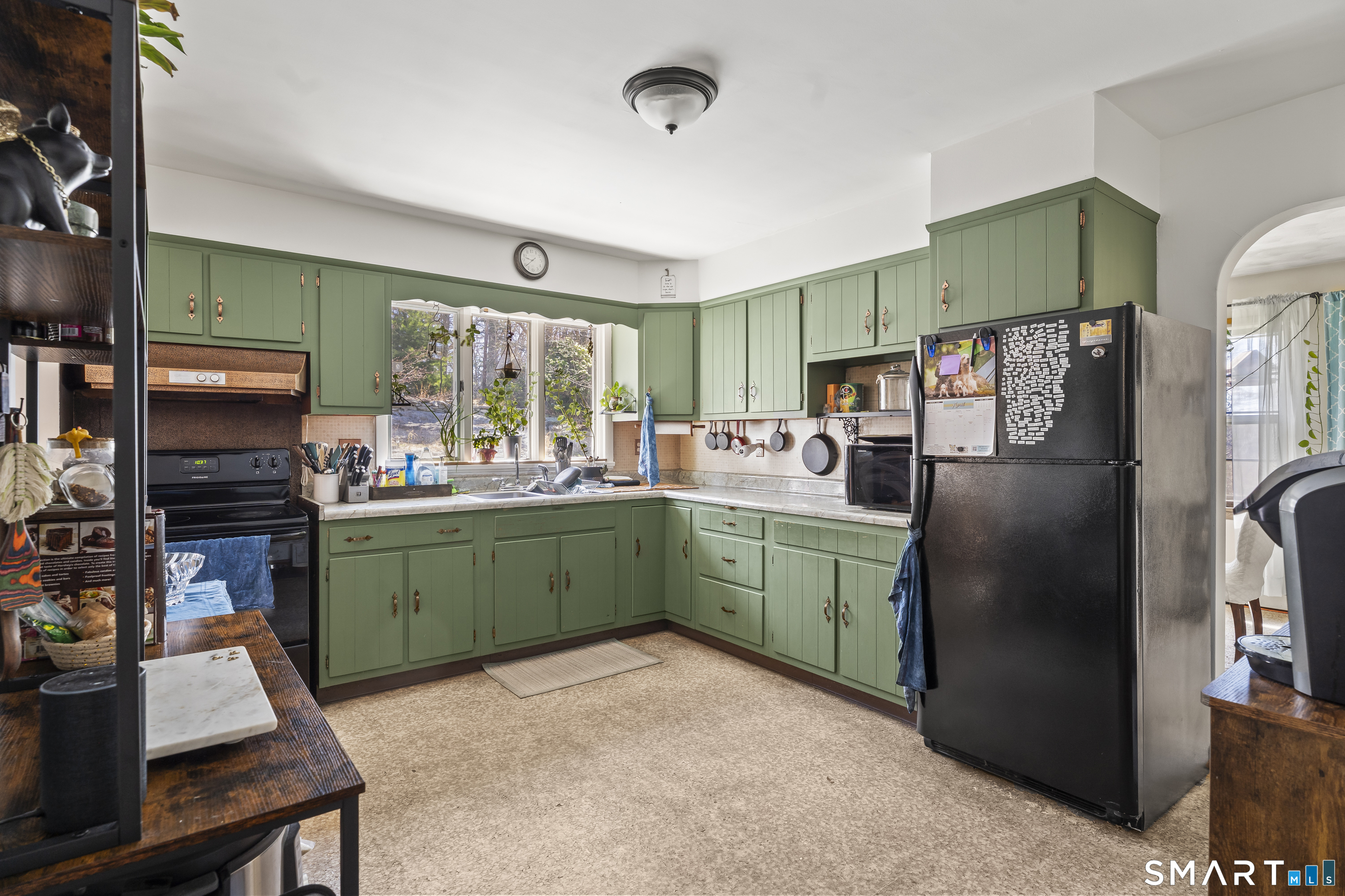 76 Lucas Park Road Norwich, CT 06360 - Photo 13 of 39 a kitchen with sink refrigerator and window