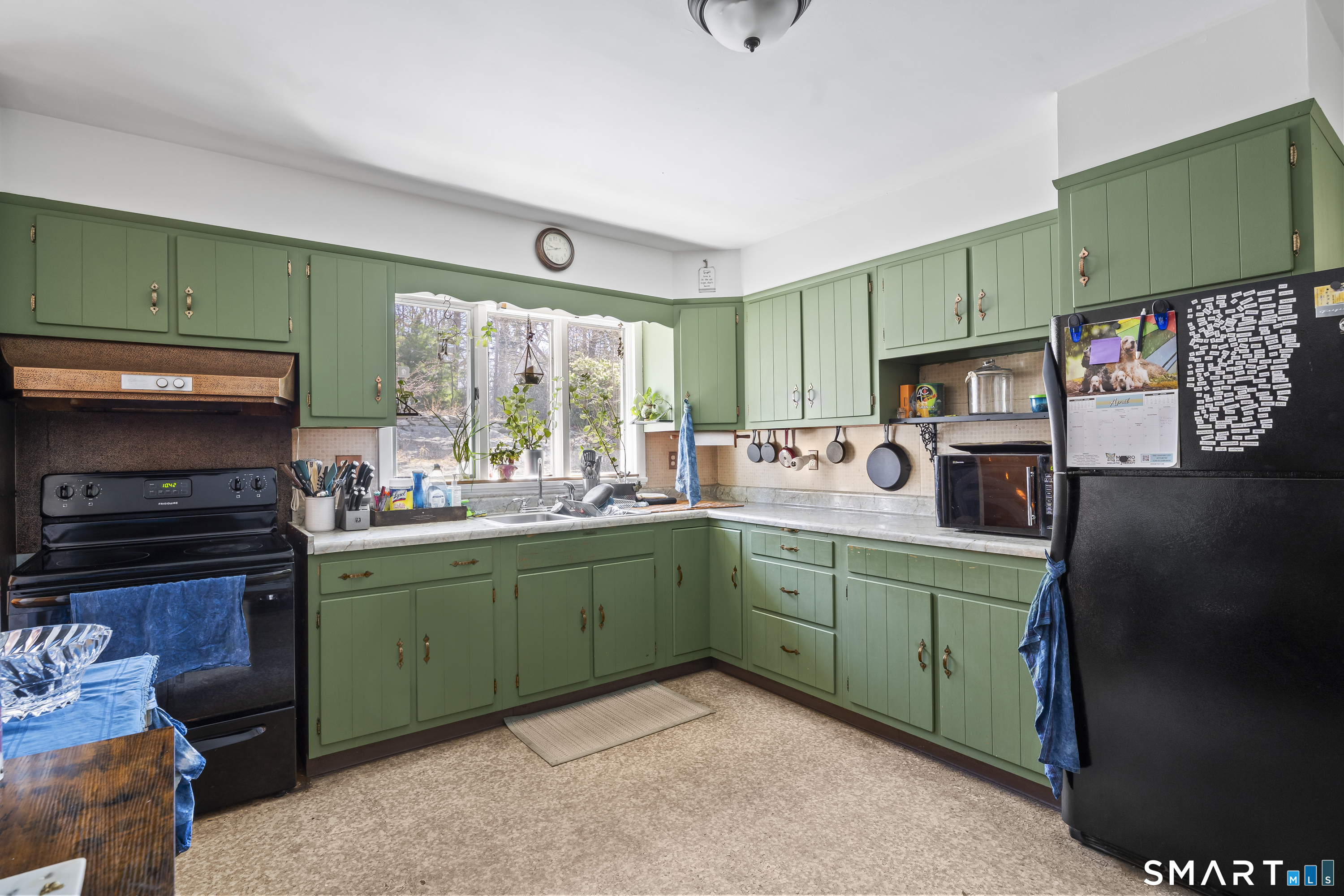 76 Lucas Park Road Norwich, CT 06360 - Photo 17 of 39 a kitchen with sink cabinets and a window
