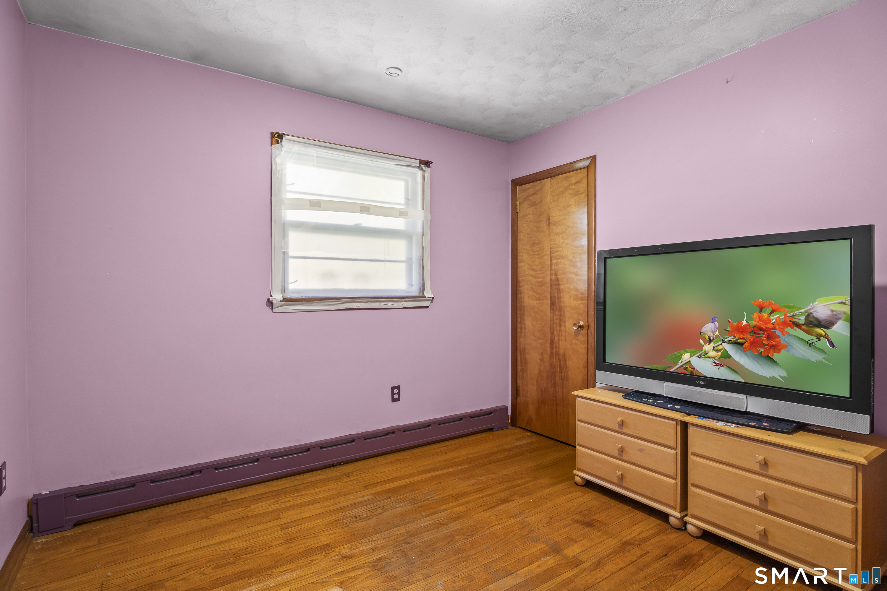 76 Lucas Park Road Norwich, CT 06360 - Photo 20 of 39 a room with window wall painting on the wall