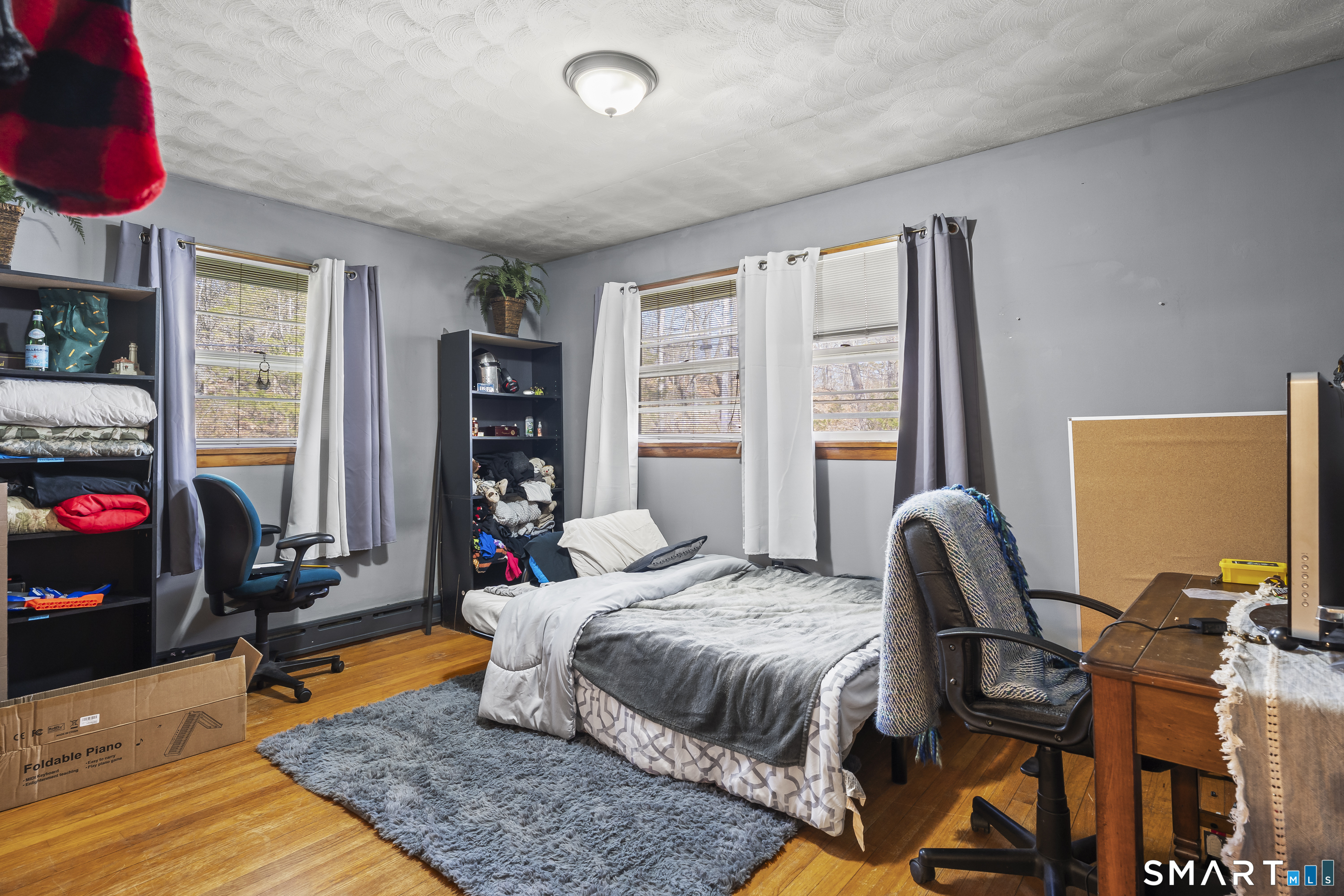 76 Lucas Park Road Norwich, CT 06360 - Photo 21 of 39 a bedroom with a bed and wooden floor