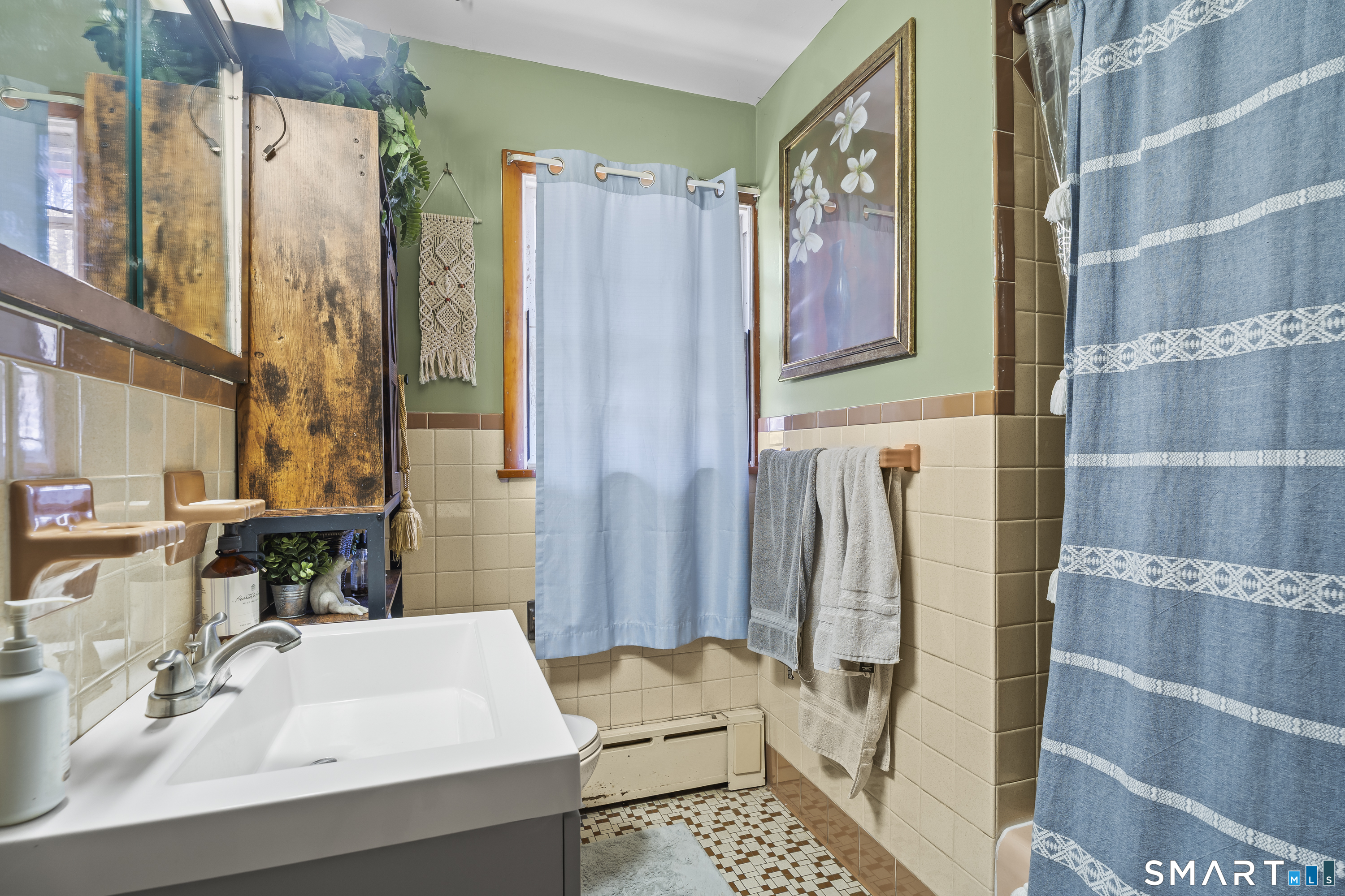 76 Lucas Park Road Norwich, CT 06360 - Photo 28 of 39 a bathroom with a sink and a mirror