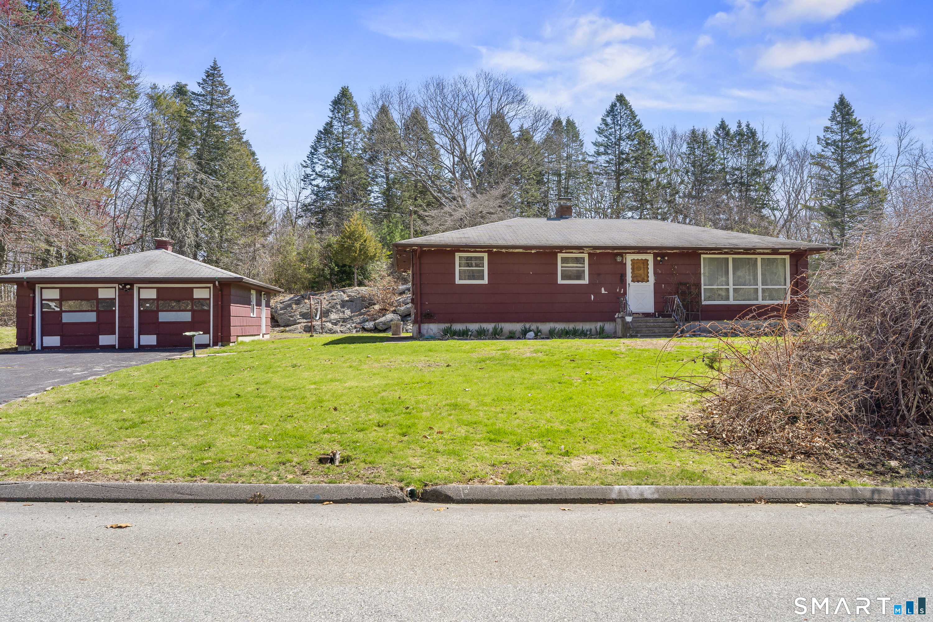 76 Lucas Park Road Norwich, CT 06360 - Photo 32 of 39 a front view of a house with a garden and yard