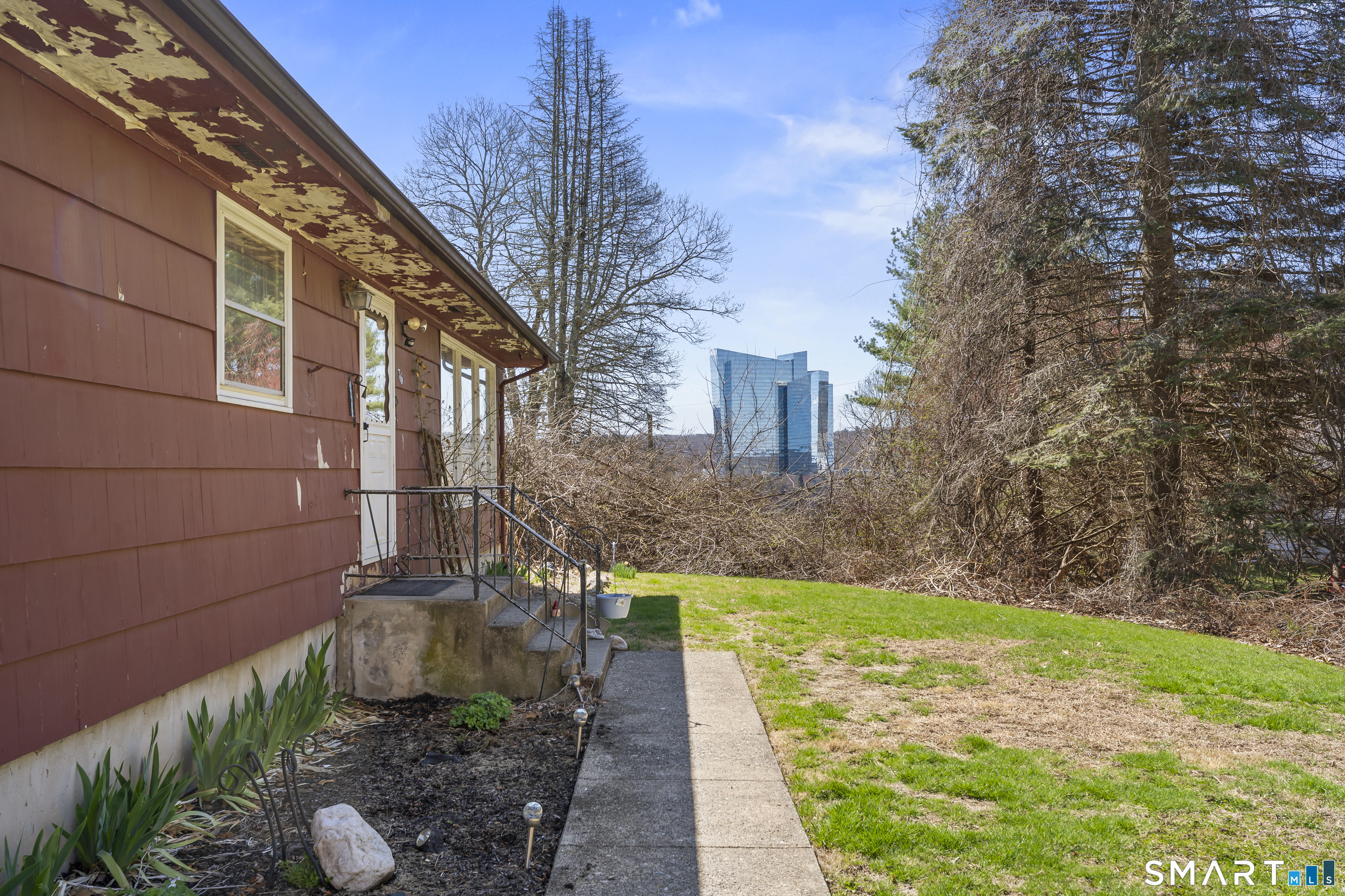 76 Lucas Park Road Norwich, CT 06360 - Photo 34 of 39 a view of backyard with plants and outdoor seating