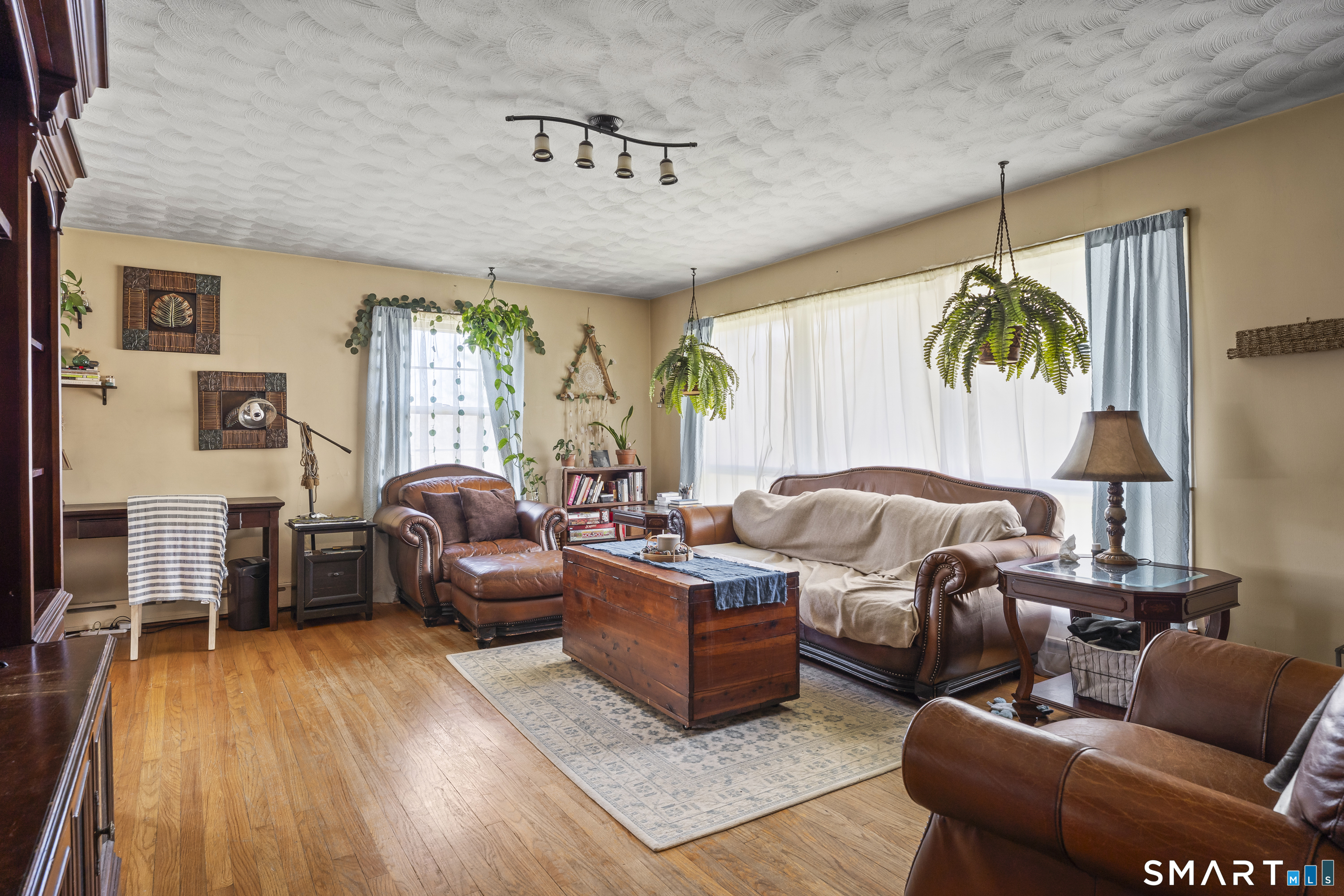 76 Lucas Park Road Norwich, CT 06360 - Photo 8 of 39 a living room with furniture and wooden floor
