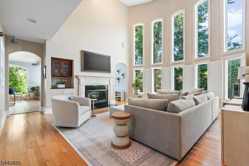 99 East Lindsley Road Cedar Grove, NJ 07009 - Photo 7 of 41 a living room with furniture fireplace and flat screen tv