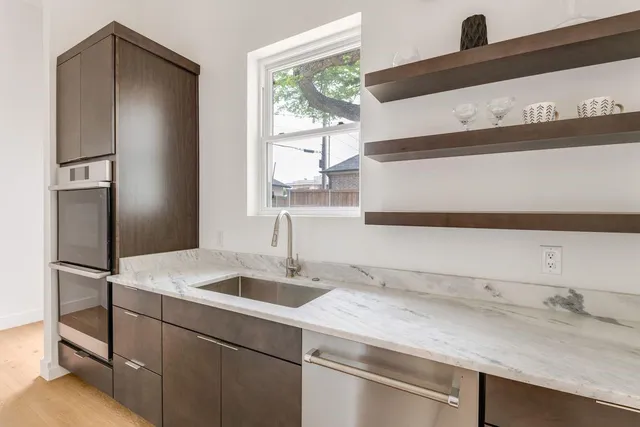 a kitchen with a sink and a refrigerator