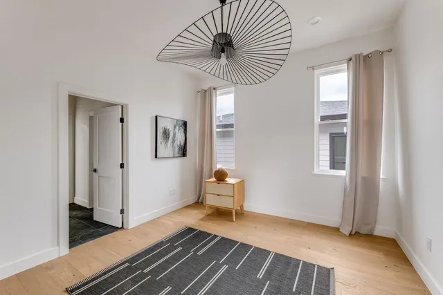 a bedroom with furniture and window