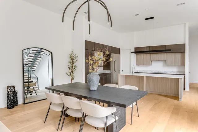a dining room with furniture and wooden floor