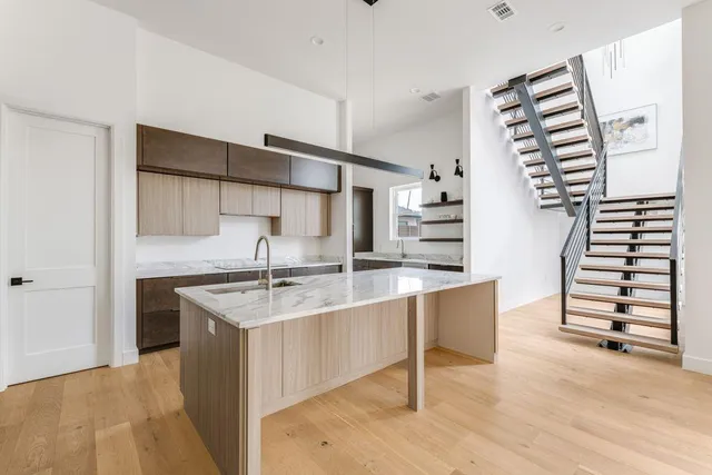 a kitchen with a sink and cabinets