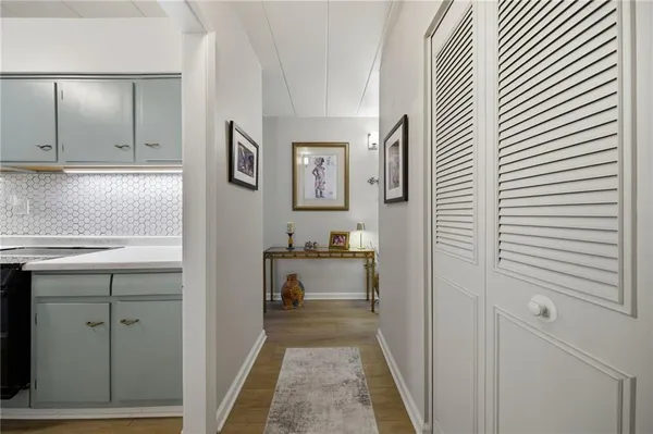 a kitchen with a sink and cabinets