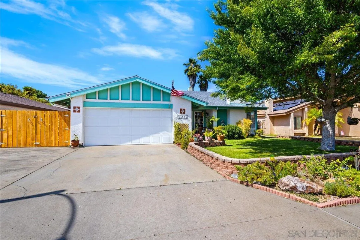 10738 2nd Street Santee, CA 92071 - Photo 43 of 52 a front view of a house with a yard and potted plants