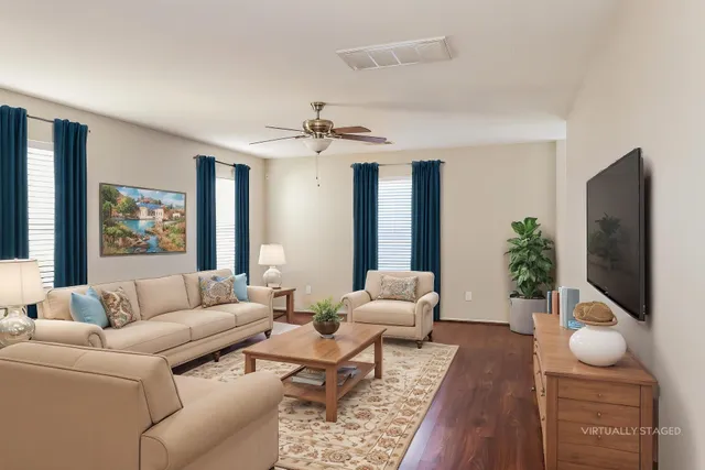 a living room with furniture and a flat screen tv
