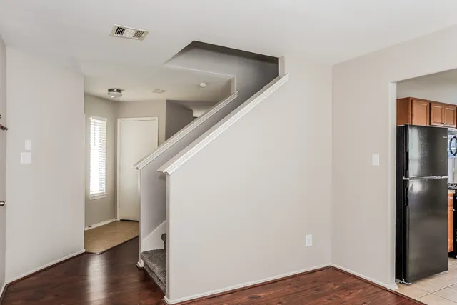 a view of entryway with wooden floor