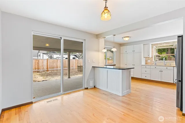 a view of a kitchen with a sink and a window
