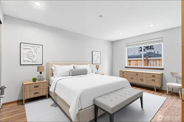 a bedroom with a bed and a dresser