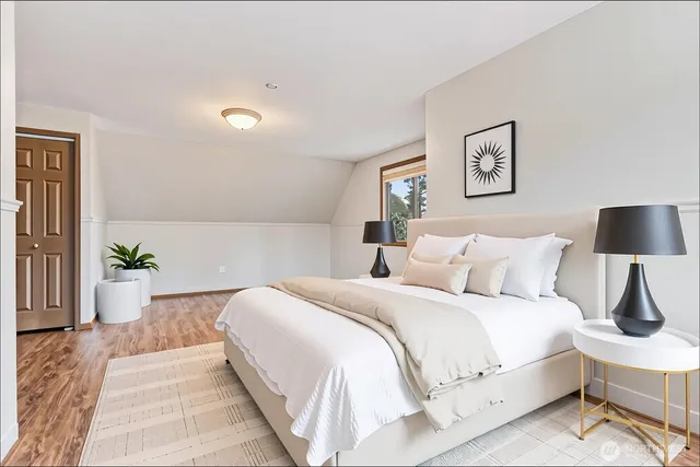 a bed room with a bed and a lamp