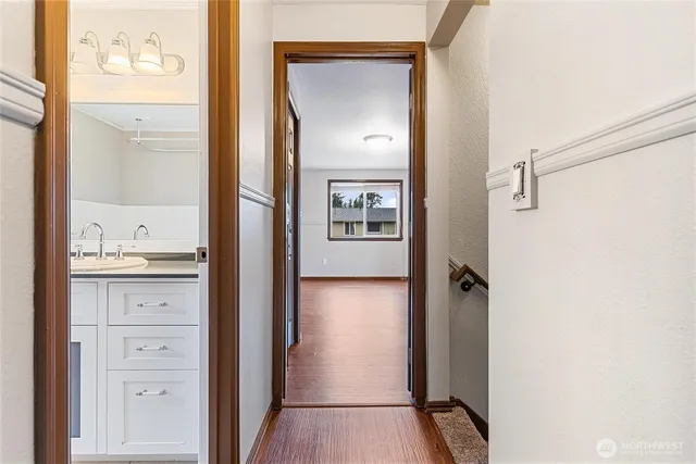 a view of bathroom with a toilet sink and mirror