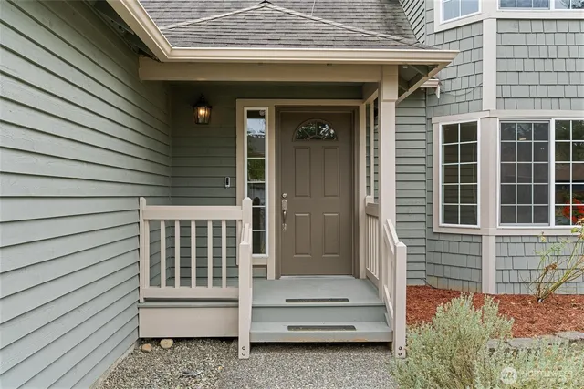 a front view of a house with garden