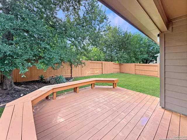 a park view with a bench and trees