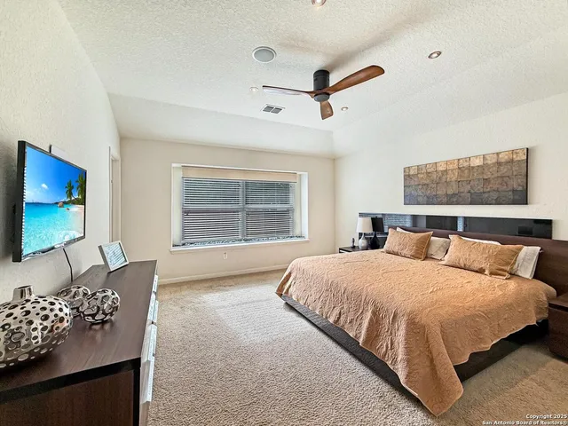 a bedroom with bed and window