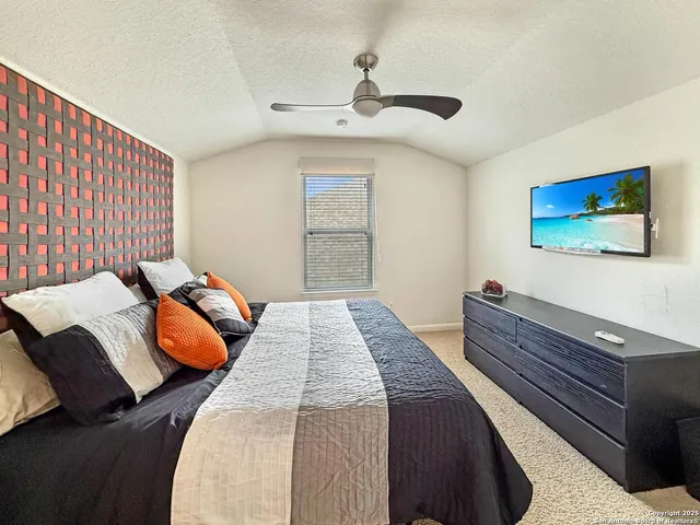 a bedroom with bed and a window