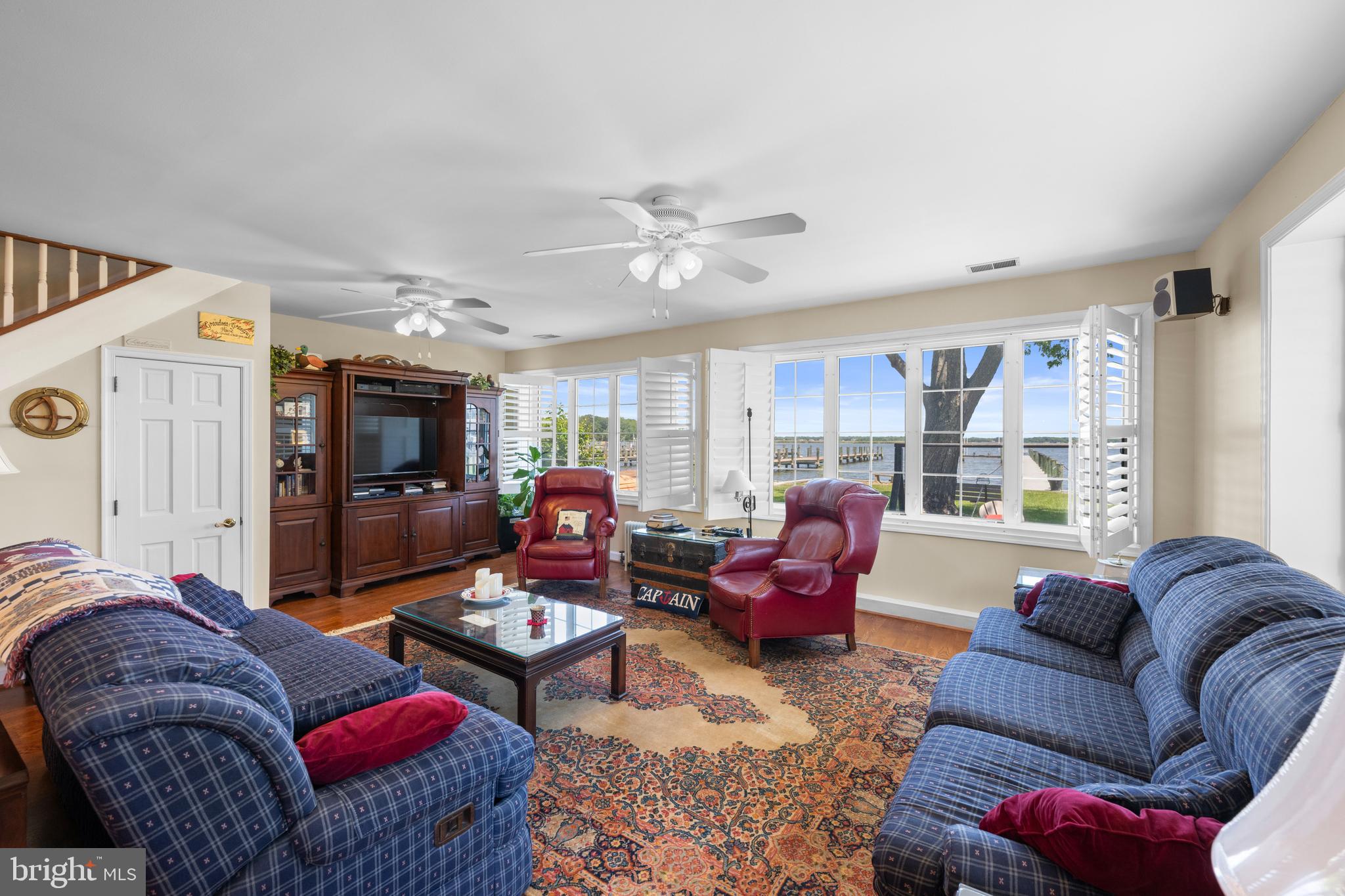 3685 1st Avenue Edgewater, MD 21037 - Photo 16 of 41 a living room with furniture ceiling fan and a rug