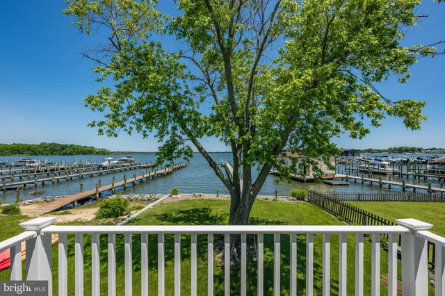 a view of a balcony with wooden floor