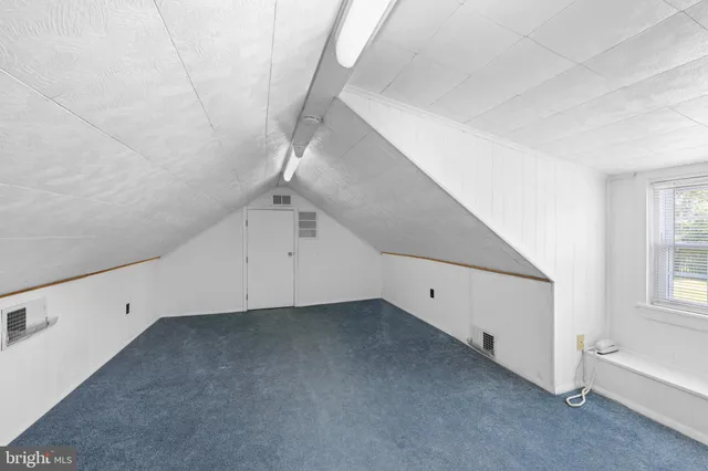 a bathroom with a sink and a window