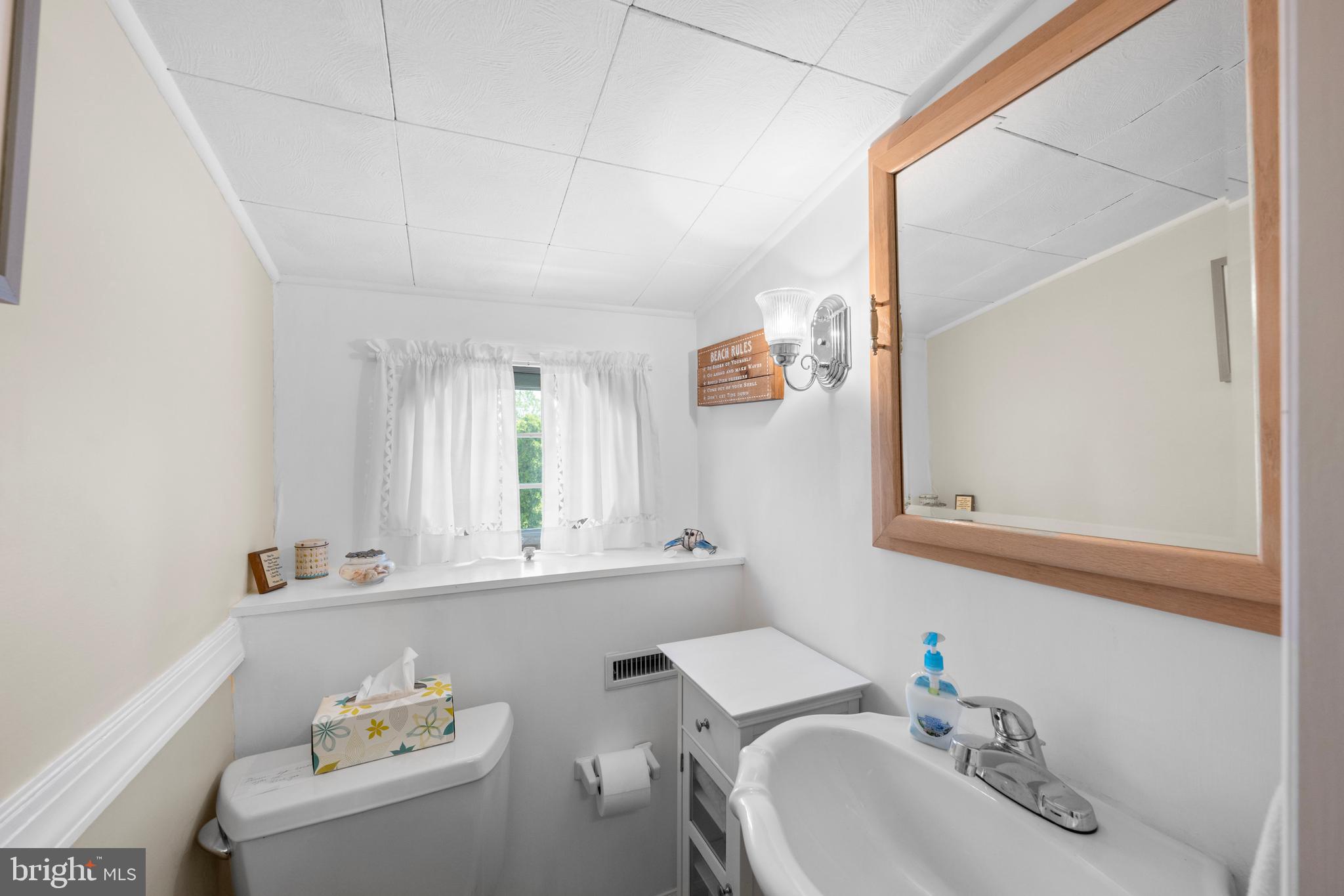 3685 1st Avenue Edgewater, MD 21037 - Photo 26 of 41 a bathroom with a sink and a window