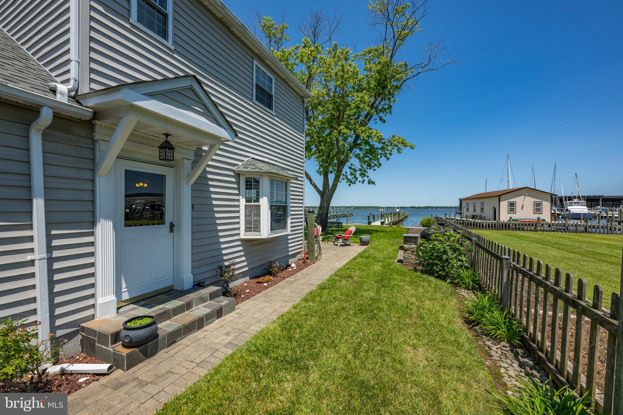 3685 1st Avenue Edgewater, MD 21037 - Photo 27 of 41 a view of a house with a yard and potted plants