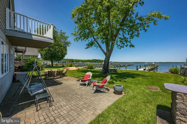 an outdoor space with furniture and garden