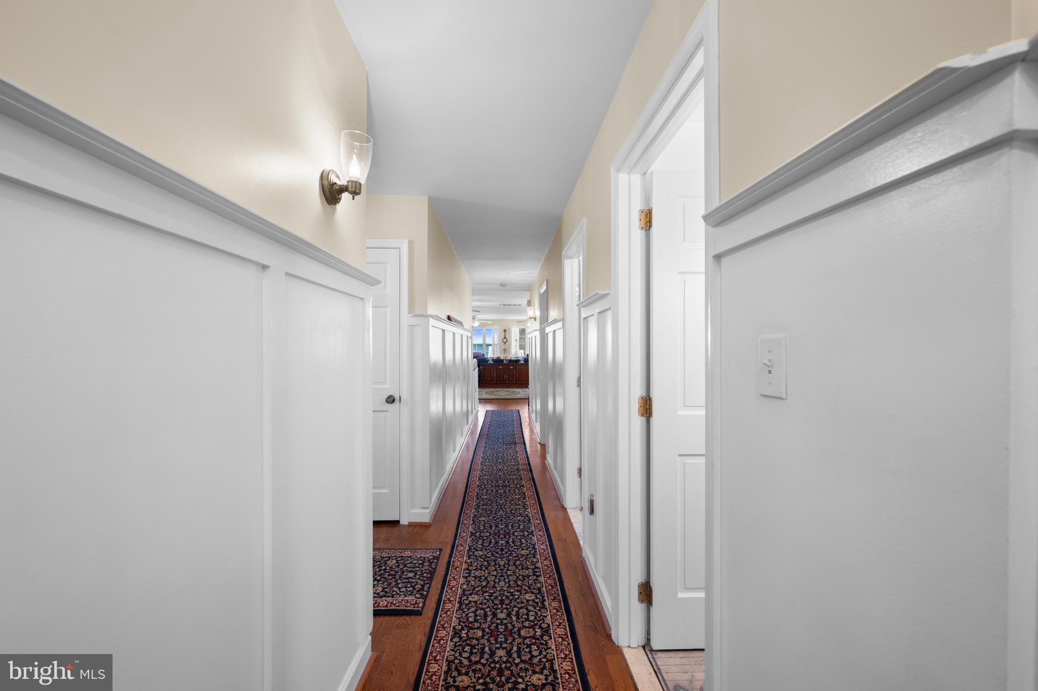 3685 1st Avenue Edgewater, MD 21037 - Photo 6 of 41 a view of a hallway with wooden floor and staircase