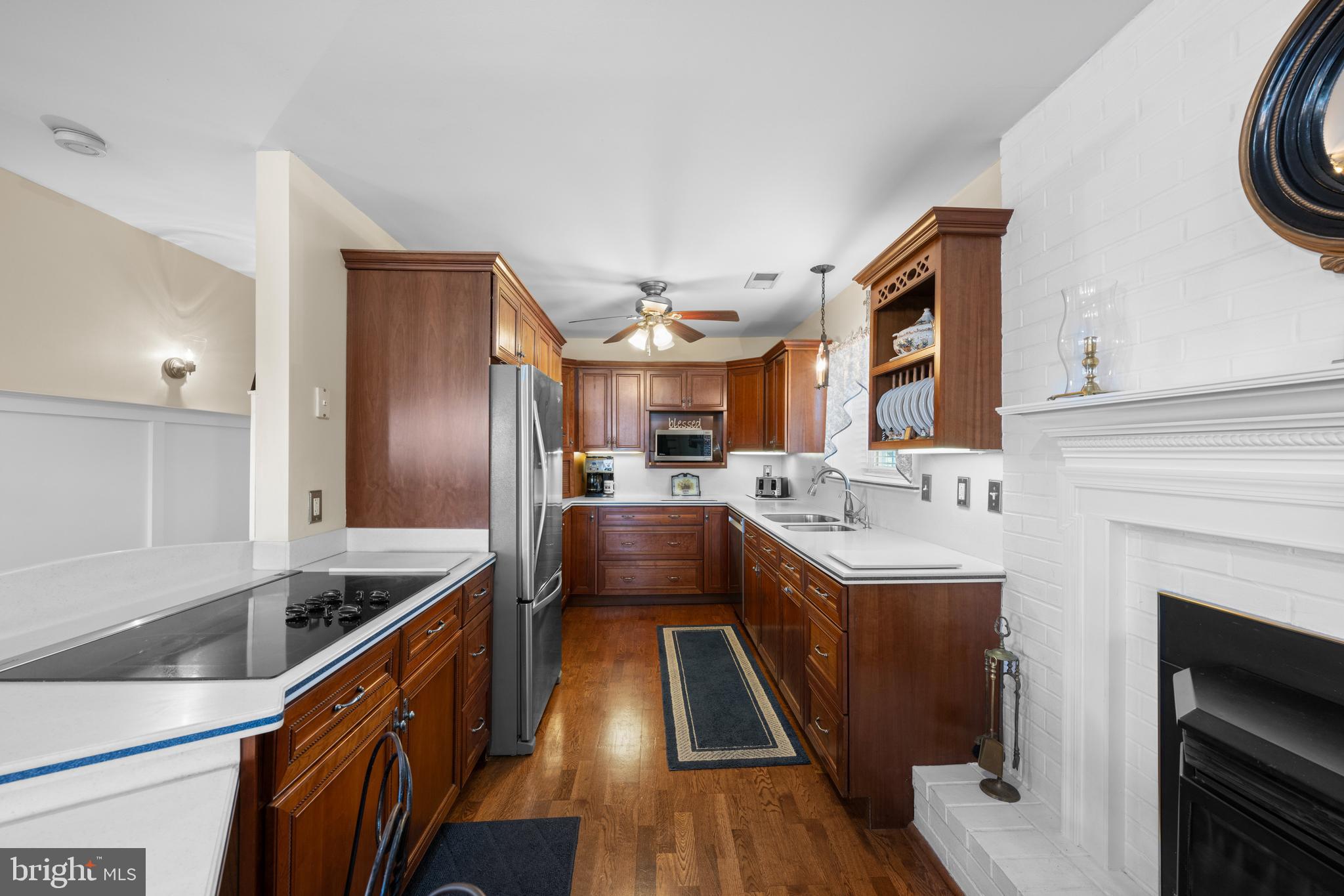 3685 1st Avenue Edgewater, MD 21037 - Photo 9 of 41 a kitchen with stainless steel appliances granite countertop a sink and a refrigerator
